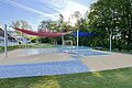 Kinderbereich mit Sonnensegel, zwei Kinderbecken und Spraypark